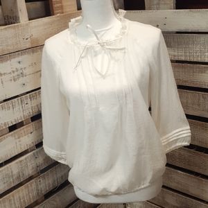 Ivory Colored blouse by Loft. Size SP
